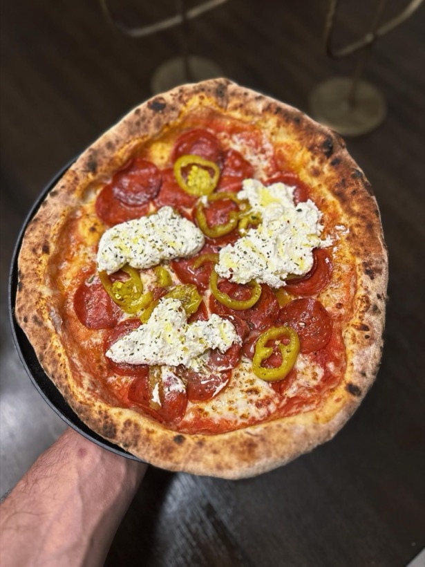 Loaded pepperoni pizza with ricotta and hot peppers