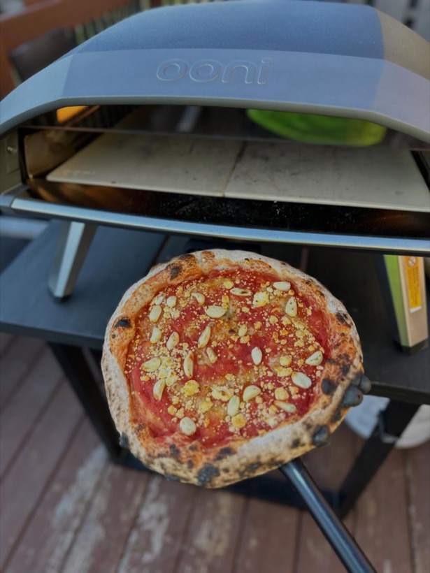 Neapolitan pizza fired in the live-fire oven